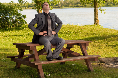 businessman-breathing-on-table