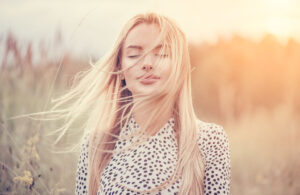 woman with hair blowing in breeze