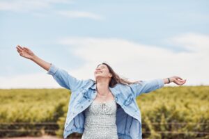 joyful woman in field