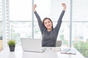 woman stretching at desk