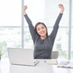 woman stretching at desk